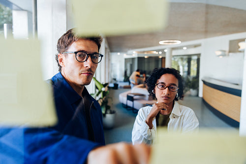 Man and woman work together in office