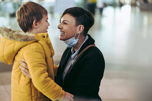 Woman meeting her son at airport