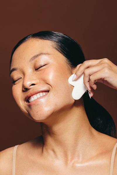 Facial self-care routine with gua sha