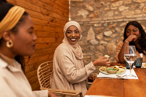 Diverse female friends having lunch together in a restaurant