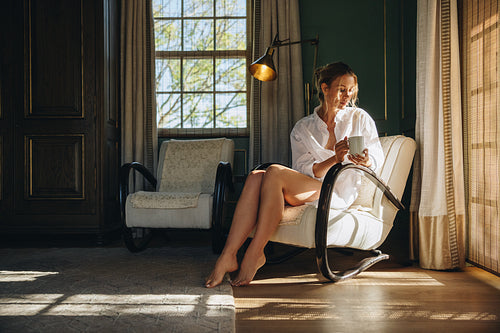 Young woman relaxing in a hotel room