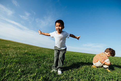 Joyful children playing in open field