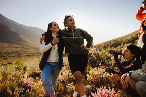 Friends hiking in scenic landscape