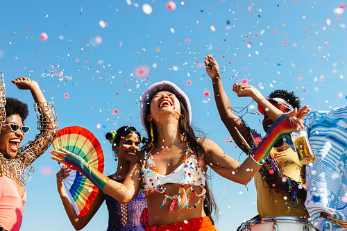 Festival party celebration with confetti and dancers