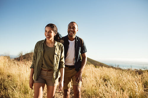 Smiling couple on a hiking adventure