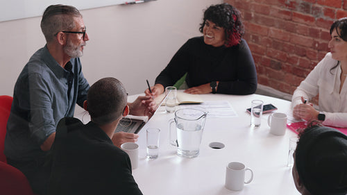 Group of business people having a meeting in an office, brainstorming and planning a project