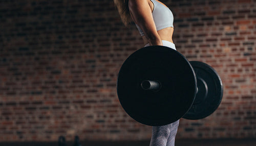 Woman exercises weight lifting