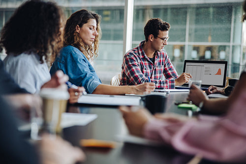Team of professionals meeting in boardroom