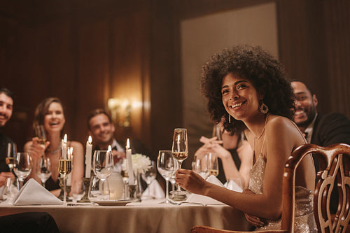 Pretty woman celebrating new years with friends