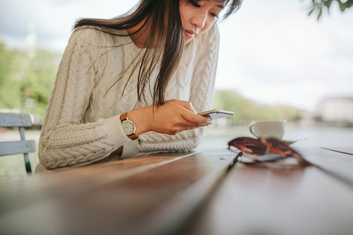 Woman using mobile phone outdoors