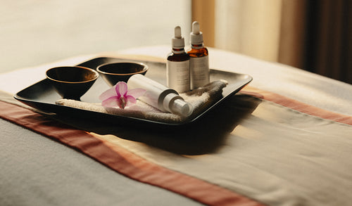 Luxury spa skincare treatment tray with serums at wellness resort