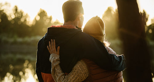 Couple standing by the lake