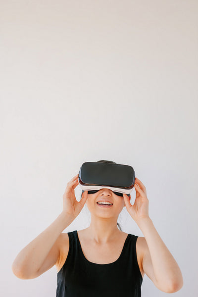 Woman using the VR headset and smiling