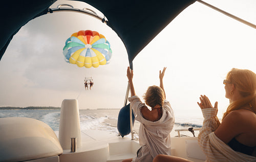 Family thrills: Shared excitement and adventure on a parasailing voyage