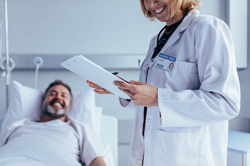 Healthcare worker with reports visiting male patient