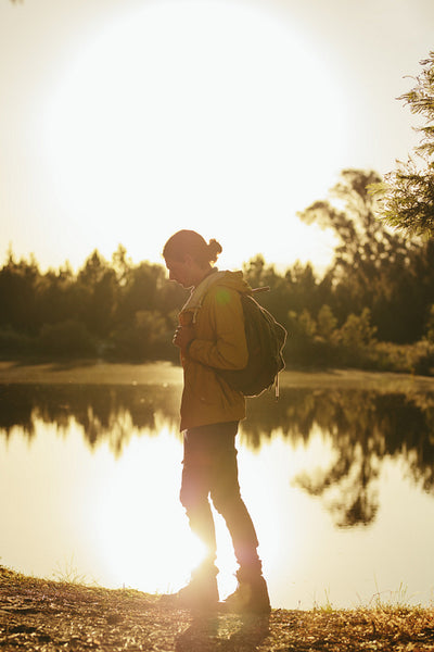 Tourist man on an exploration trip in a forest