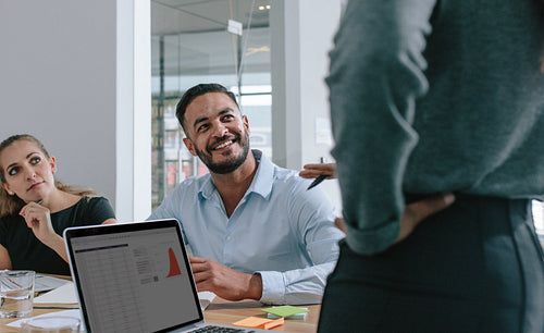Smiling male professional in business meeting