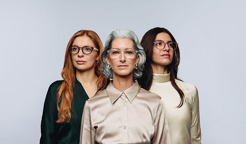 Confident women of different ages wearing eyeglasses in studio for optometry