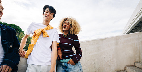 Young friends smiling and laughing in candid moment
