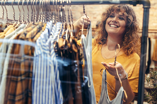 Customer choosing dress in store