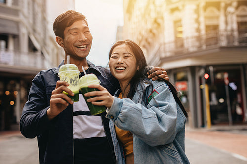 Loving young couple walking on a city street