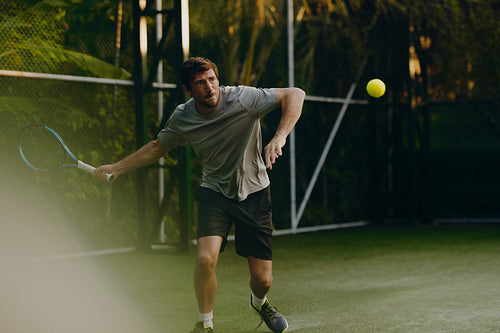 Tennis player enjoying a game on a tropical holiday