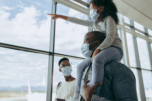 Family going for boarding their flight during pandemic