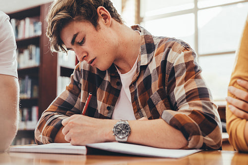 Student studying in high school library