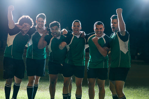 Professional rugby players celebrates a victory