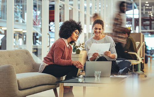 Women entrepreneurs sitting in a lounge at work place