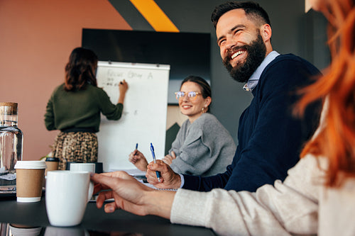 Happy businesspeople smiling during a meeting