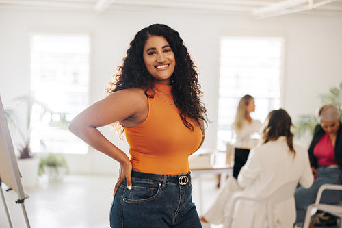 Young businesswoman smiling happily in a meeting room