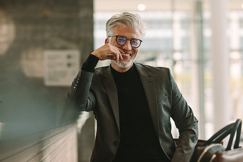 Mature businessman sitting at cafe