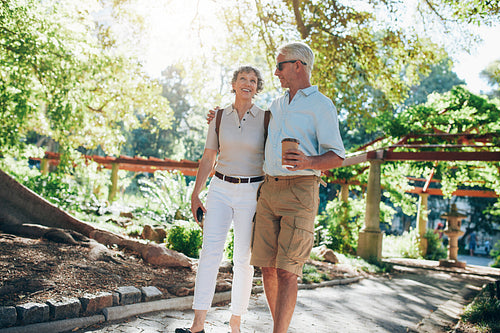 Loving senior couple enjoying a walk in the park