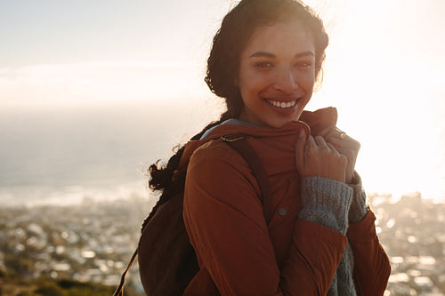 Woman in warm wear smiling at camera