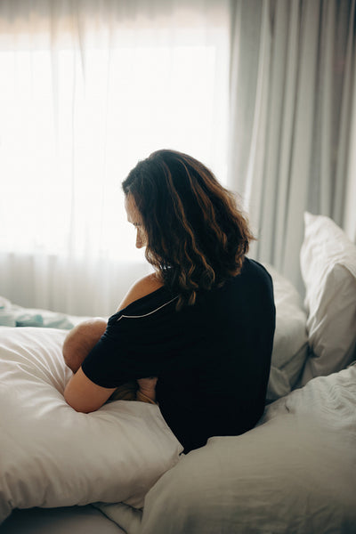 Mother nursing child in morning