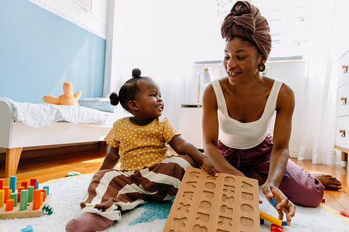 Mother and child play together at home