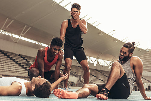 Group of athletes relaxing after workout