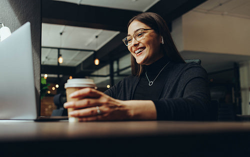 Businesswoman attending an online meeting in the morning