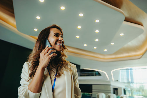 Professional female in modern office on a mobile phone call