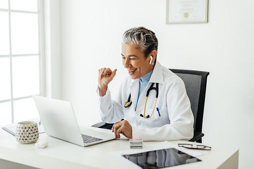 Telehealth during quarantine: Female doctor consulting her patients over a video call