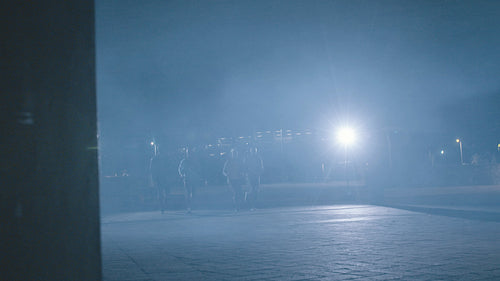 Fitness people running in city at night