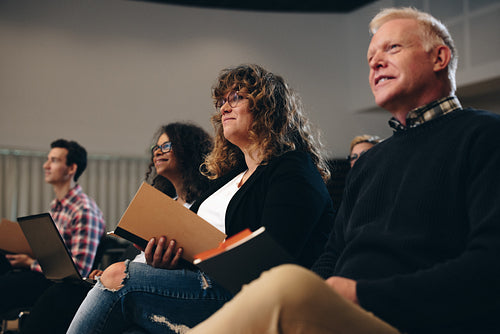 Business people attending a corporate seminar