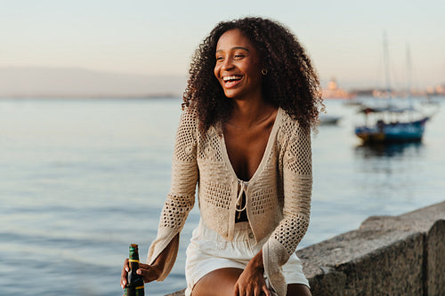 Young Brazilian woman enjoying sunset at Mureta Da Urca