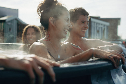 Hot tub spa relaxation with friends enjoying outdoor water and wellness together