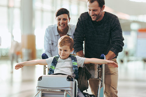 Family enjoying while waiting at airport