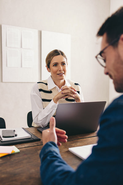 Businesswoman listening to a job applicant during an interview