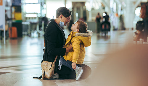 Loving mother and son at airport