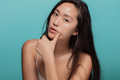 Asian woman with glowing skin