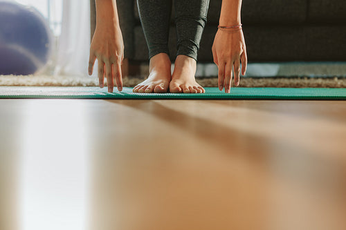 Girl's hands and feet during yoga workout